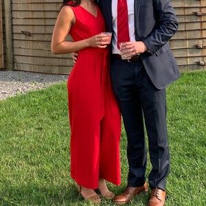Red Calvin Klein jumpsuit. Full length